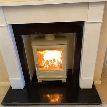A new smooth construction fireplace with a stove